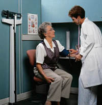 Picture of an elderly woman having her blood pressure checked