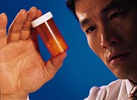 Photo of physician with pill bottle