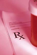 Picture of a prescription pad and a pill bottle