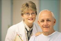 Picture of a female physician and an older male patient