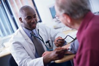 Photo of a middle-aged man with a physician