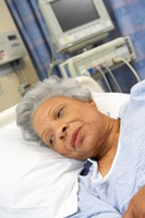 Picture of an older African American woman in a hospital bed